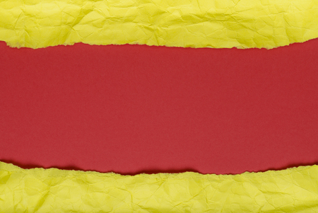 Background of crumpled paper yellow red horizontalの写真素材