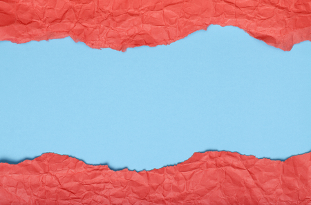 Background of strips of crumpled paper red blueの写真素材