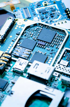 Electronic boards with chips, electronic components and precious metals close-up, soft focus,...