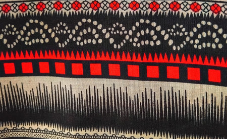 Colorful geometric textile pattern with symmetrical ethnic motifs and decorative woven traditional...