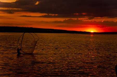 fishermen at sunsetの写真素材
