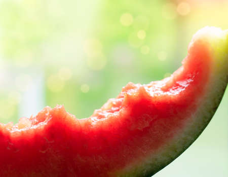 Selective focus fresh Sweet watermelon on white background, soft focus of bite mark inside of watermelon, red surface with juicy, Spring oe Summer fruite topicanaの写真素材