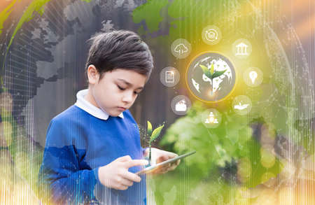 School kid using tablet research on internet about world population, Ecology and Environmental,Boy...