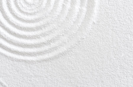 Sand texture with simple spiritual patterns,Japanese Zen Garden with concentric circles and parallel lines on  white sandy surface background,Harmony,Meditation,Zen like conceptの写真素材