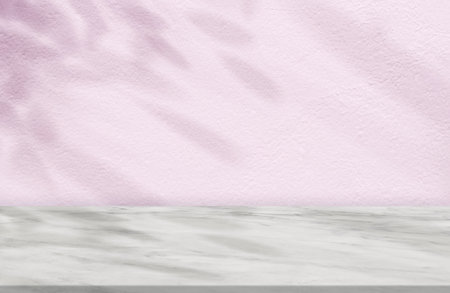 Pink Concrete Wall Texture with Leaves Shadow on Marble floor Background,Empty Cement Studio Room with Marble Top,Backdrop background Spring,Summer Cosmetic Product Display,Mockup Presentationの写真素材