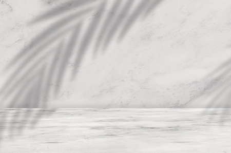 Marble texture background with blurry coconut palm leaves on wall ,White or Grey nature granite wall surface for Ceramic counter or interior decoration.Luxury design backdrop product backgroundの写真素材