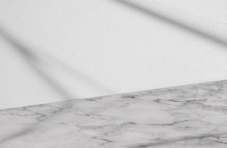 Studio Background Concrete Wall Texture Background with Shadow Line on Marble floor,Empty Grey Room with Sunlight overlay on Table Top,Mockup Backdrop Banner for Cosmetic Product Display Presentationの写真素材