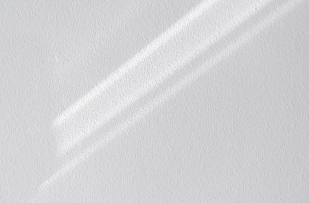 White wall concrete texture with abstract drop diagonal shadow. Sunlight overlay on white plaster paint on concrete floor,Light effect for Monochrome photo,mock up,poster, wall artの写真素材