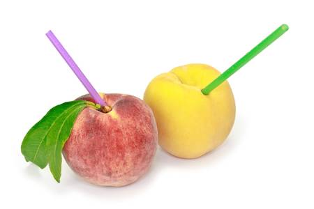 Pare of juicy red and yellow peaches with drops of water on them are ready to freshen you.の写真素材