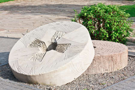 Decorative carved millstones in the parkの写真素材