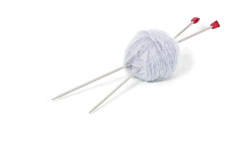Grey woolen mohair clew with knitting needles  isolated on white background