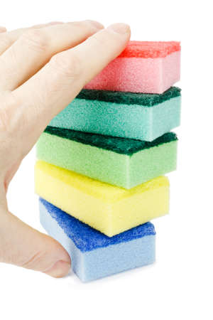 Male hand taking color sponges isolated on white backgroundの写真素材