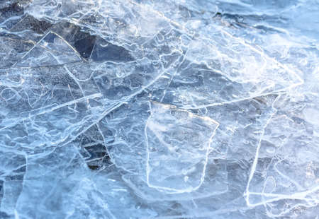 Close-up of cracked ice texture on river in spring time
