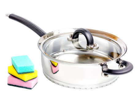 Stainless steel deep stewing pan with sponges isolated on white backgroundの写真素材