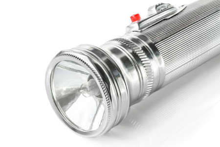 Old metal pocket flashlight isolated on white backgroundの写真素材