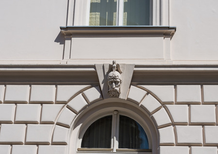 Face on facade of an old building in Zagreb.の写真素材
