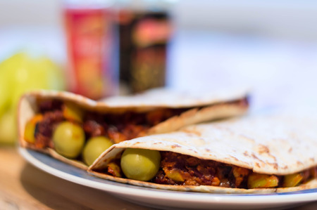 Home made tortillas with paprika, beens, and chicken with hot sauce and paprika in background. Food photography close up. Different viewの写真素材