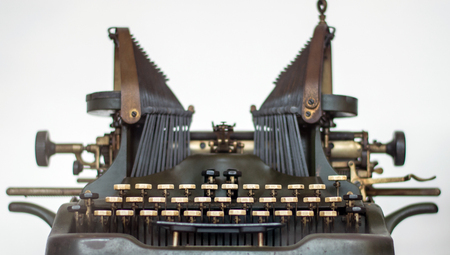 Old typewriter antique machine close up photography on a white backgroundの写真素材