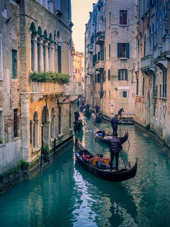 gondolas walking through the canals of Veniceの写真素材