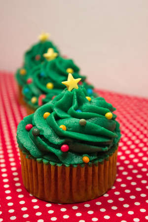 Typical Christmas sweets. Christmas tree shaped cupcakes. Christmas concept.の写真素材