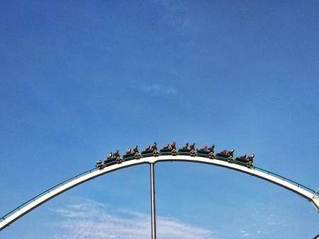 Roller coaster in amusement park over blue sky, Salou, Tarragona, Spainの写真素材