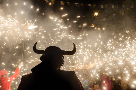 correfocs party with fire and demon silhouetteの写真素材