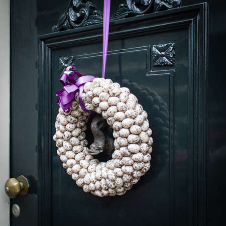 Traditional Easter eggs at the entrance door. Concept of Easterの写真素材