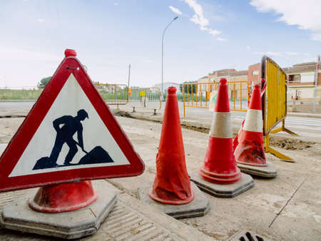signage billboards on a street under constructionの写真素材