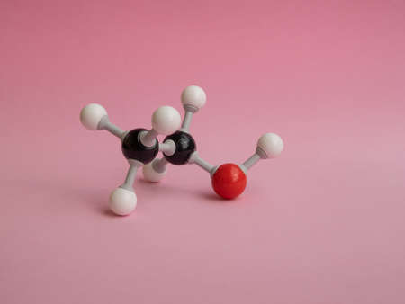 Photo of a molecular atom model isolated on a pink background.の写真素材