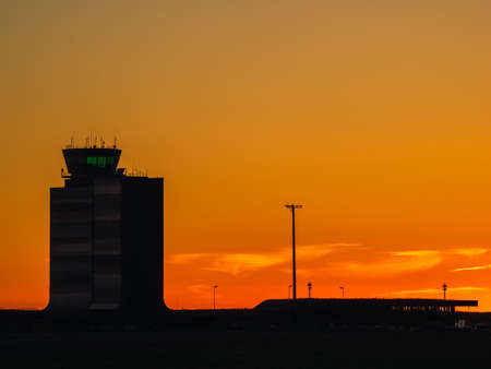 Silhouette of Alguaire airport, Lleida, Catalonia at sunset. Control towerの写真素材
