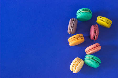 Funny colorful macaroon cookie dessert with blue background Copy spaceの写真素材