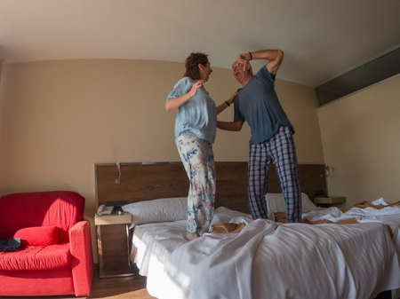 Love lives forever! Older couple in a hotel. Older man and woman enjoy spending time together. Have...