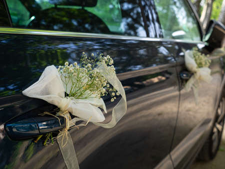 Wedding decoration with flowers on the white car. wedding conceptの写真素材