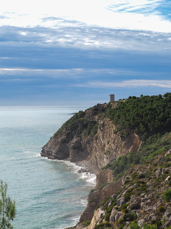 view of the cliff in the Sierra de Irta with the Badum Tower of PeÃ±Ã­scolaの写真素材