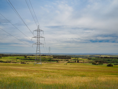 Image of high voltage substation. Distribution electrical power of pylons and equipment.