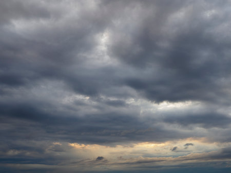 Gloomy clouds have shrouded the sky before a thunderstormの写真素材