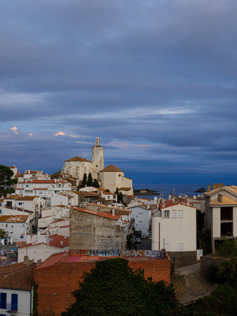 White houses and blue sea at the port of CadaquÃ©s with church from behind, Costa Brava, Spainの写真素材