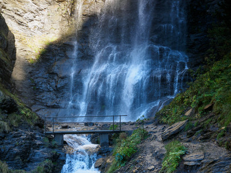 Waterfall crossed by a bridge on the Three Waterfalls Trail in Cerler, Benasque, Ribagorza, Huesca, AragÃ³n, Spainの写真素材