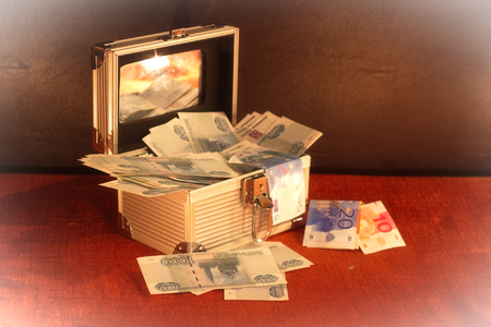 Godsend money bills in a silver Christmas gift trunkの写真素材