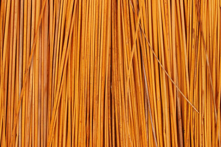 Texture of straw yellow light densely packedの写真素材