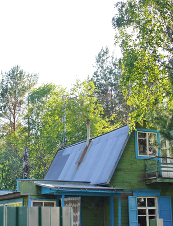 Old chimney on the roof of a village houseのeditorial素材
