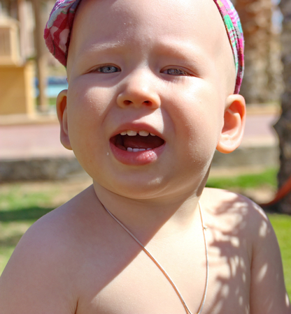 Little boy kid child closeup on a summer holidayの写真素材