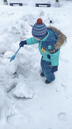 Man Young Snow digging with a shovel winter