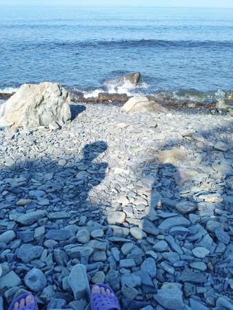 Shore Sea Surf in summer on a clear dayの写真素材
