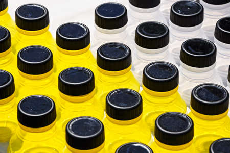 Abstract of yellow and clear glass containers used in range of health and beauty environmentsの写真素材
