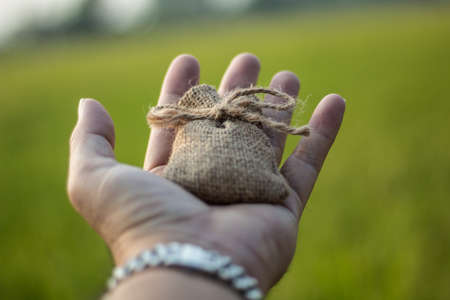 Small linen bag, small sackcloth bag knotted with jute twineの写真素材