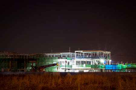 BANGKOK THAILAND - MAY 08,2020: Construction at night with lights against the dark sky