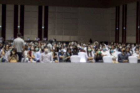 Blurred picture a sit of people to waiting for make meeting with wearing mask on the new normal concerned with after COVID-19 crisis.の写真素材