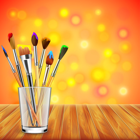 Art brushes in glass on wooden table, colorful blur background realistic vectorのイラスト素材