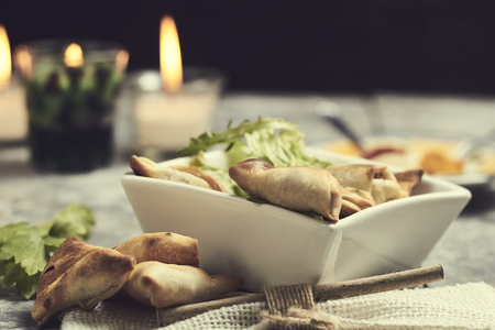 crunchy samosas baked in a dark light background
